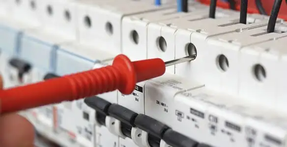 Electrical contractor testing circuit breakers during electrical repair in Oldsmar, FL