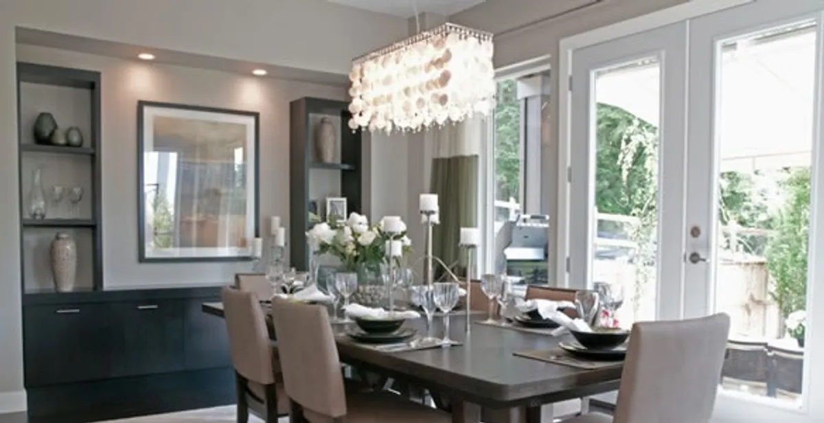 Elegant dining room chandelier installation above table in Tampa, FL