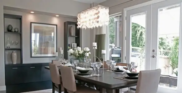 Elegant dining room chandelier installation above table in Tampa, FL