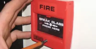 fire alarm installation service showing manual fire alarm pull station installed by licensed electricians in Tampa, FL