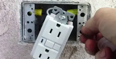 gfci circuits service showing installation of a ground fault circuit interrupter outlet by licensed electricians in Tampa, FL