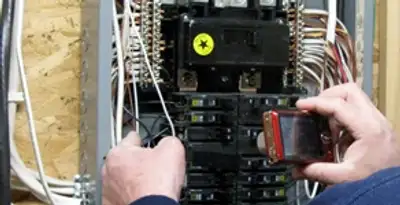 Home electrical inspection of circuit breaker panel by licensed electrician in Tampa, FL