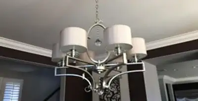 Modern chandelier installation with multiple light fixtures in Tampa, FL