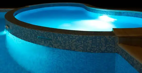 pool light installation and repair services highlighting illuminated pool interior lighting in Tampa, FL