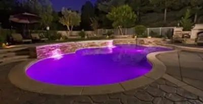 pool light installation and repair services illuminating a residential swimming pool in Tampa, FL