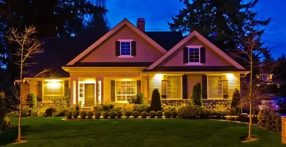 security light installation services illuminating a residential exterior at night in Tampa, FL