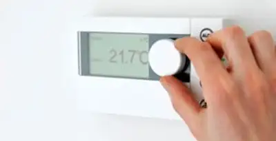 Thermostat installation service with professional adjusting temperature control in Tampa, FL